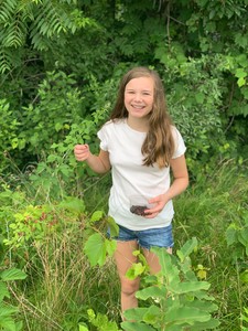 Tessa berry-picking in the back field