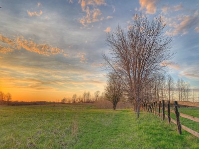 Sunset over the back field at Snug Cottage